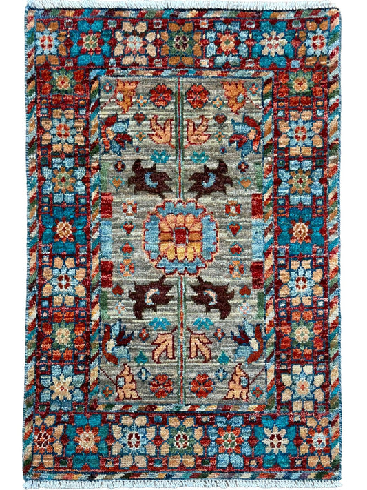 Multicolored patterned rug with intricate design on a white background