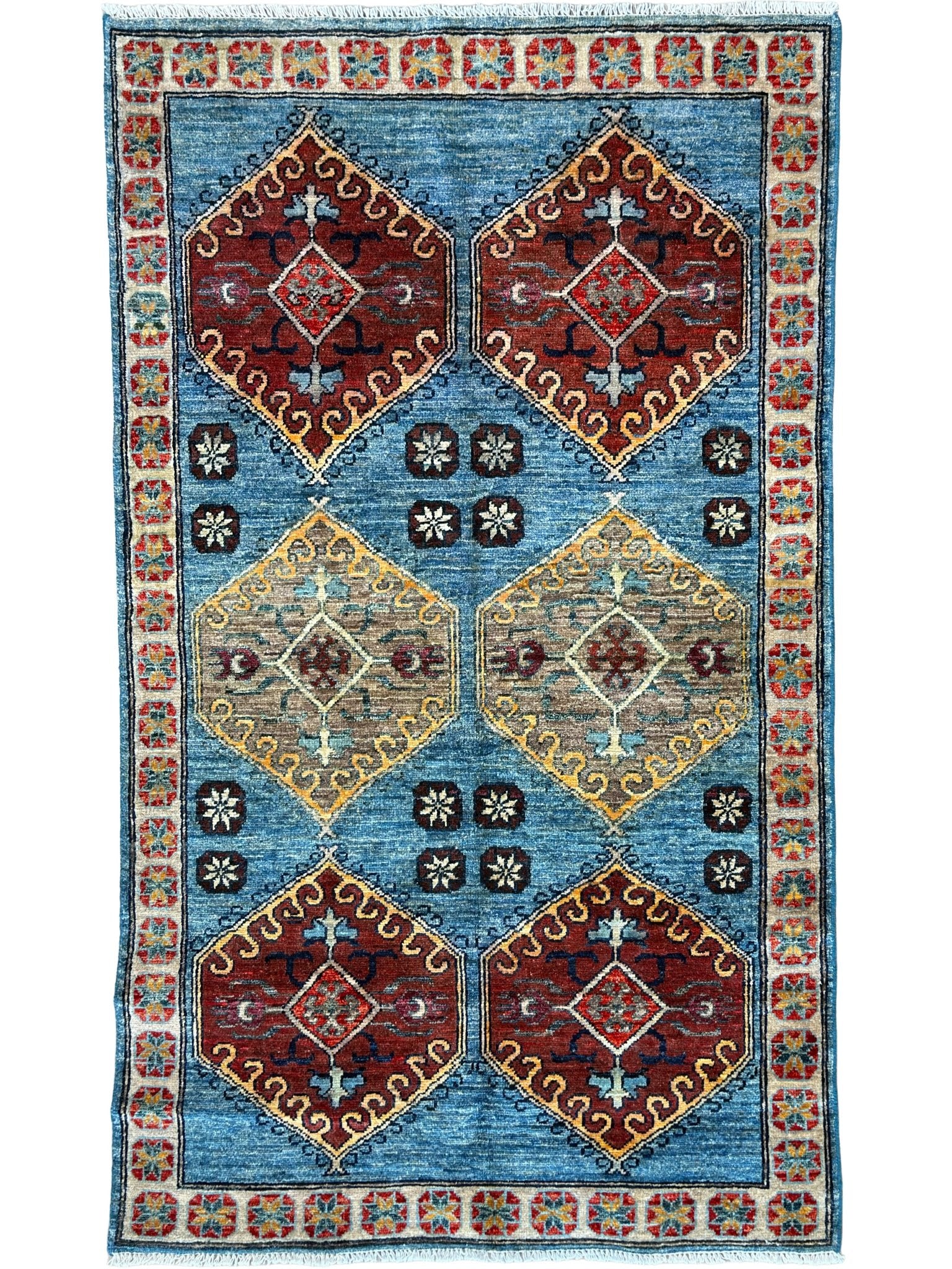 Decorative rug with geometric pattern on a blue background