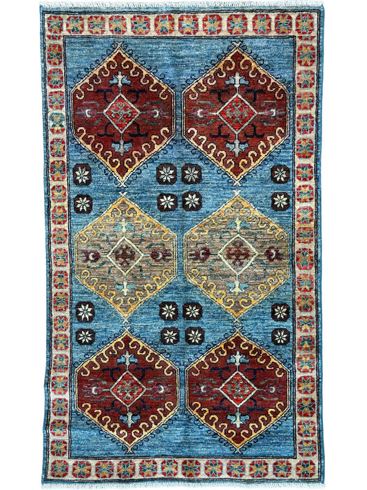 Decorative rug with geometric pattern on a blue background