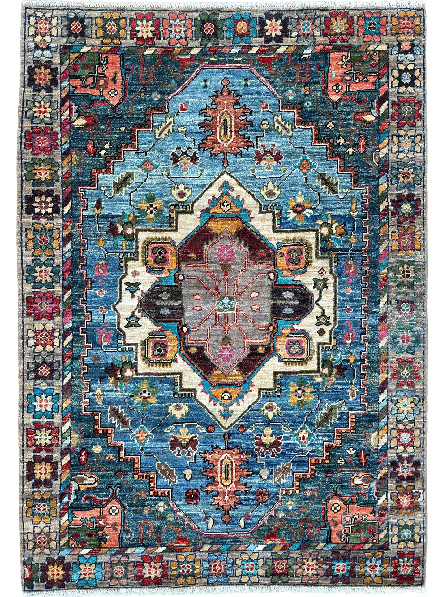 Decorative rug with intricate patterns and colors on a plain background